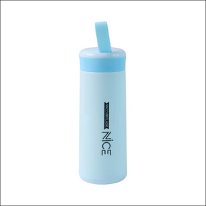 Blue vacuum insulated leak proof glass water bottle with a flip lid for easy drinking