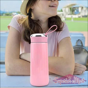 Stylish pink leak proof glass water bottle with a durable cap and handle for easy carrying