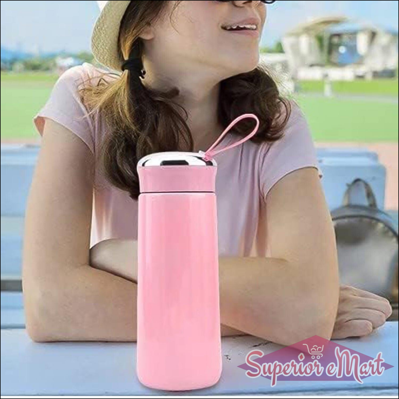Stylish pink leak proof glass water bottle with a durable cap and handle for easy carrying