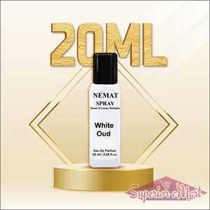 Nemat 20ml White Oud spray perfume in a white bottle with black cap on a gold podium against a gold background.