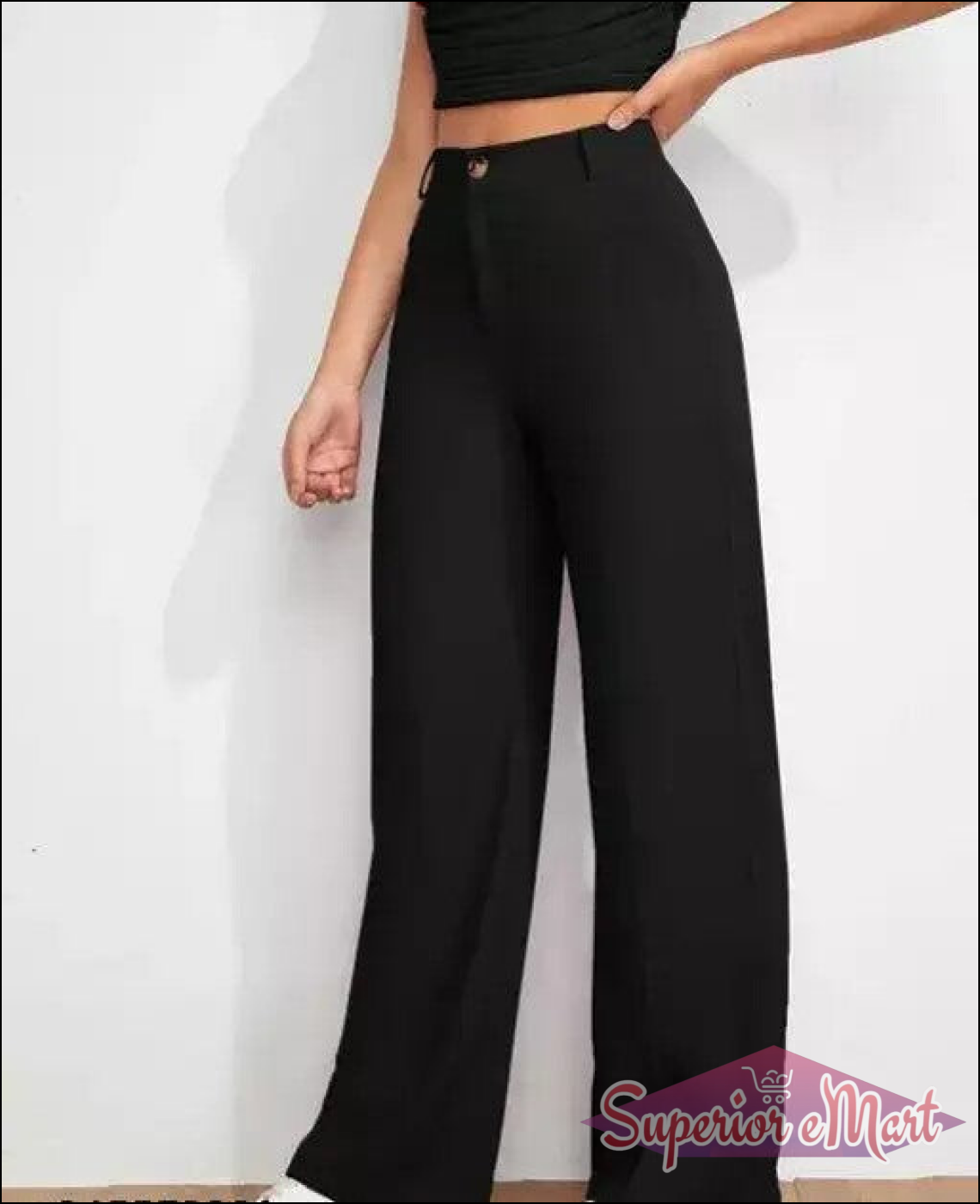 Person wearing black high-waisted pants on a white background