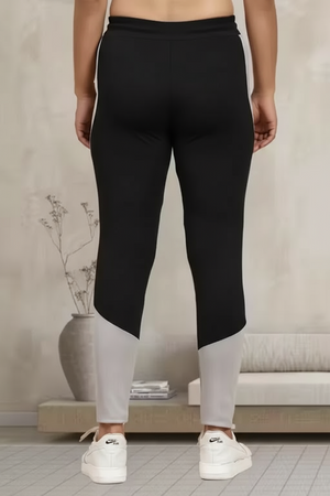 Back view of women's multicolor jeggings featuring black and gray colorblock design for comfort and style