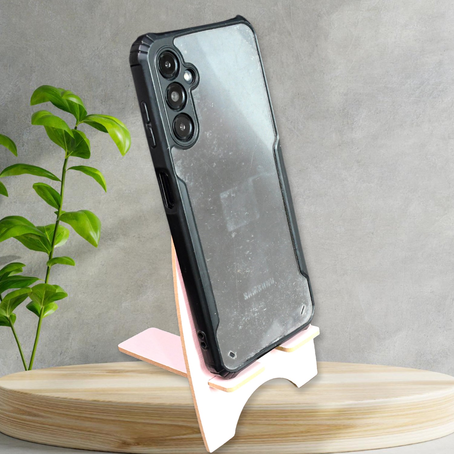 Wooden rabbit phone stand elegantly displaying a smartphone on a stylish surface
